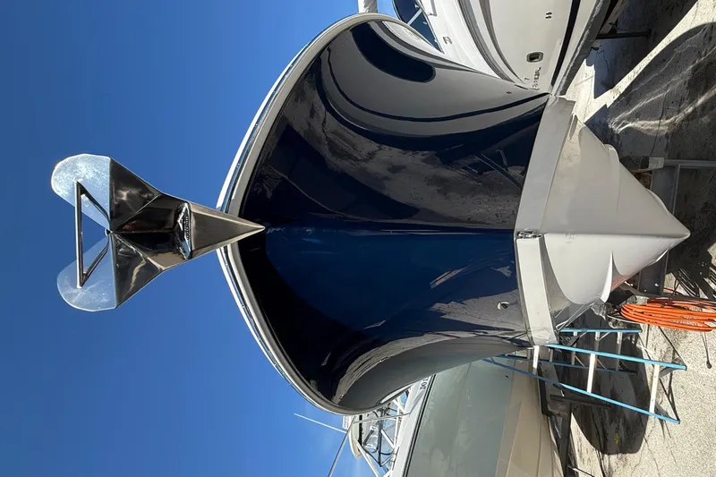  Yacht Photos Pics 2016 Edgewater 280CC boat with a sleek blue hull and stainless steel anchor.