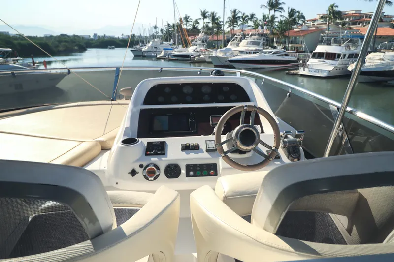 Yacht Photos Pics Helm of 2009 Sunseeker Manhattan 70 yacht, overlooking marina with luxury boats,&nbsp;for sale in Mexico by Servicios Nauticos and Gaston Troche
