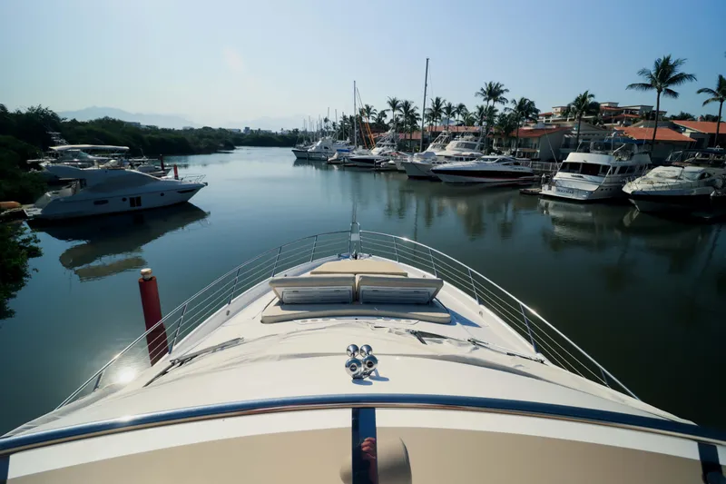  Yacht Photos Pics Bow view of 2009 Sunseeker Manhattan 70 yacht in a marina with palm trees,&nbsp;for sale in Mexico by Servicios Nauticos and Gaston Troche