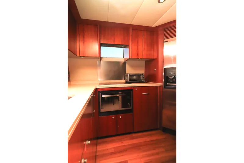  Yacht Photos Pics Luxurious kitchen interior of 2009 Sunseeker Manhattan 70 yacht with wood cabinetry,&nbsp;for sale in Mexico by Servicios Nauticos and Gaston Troche