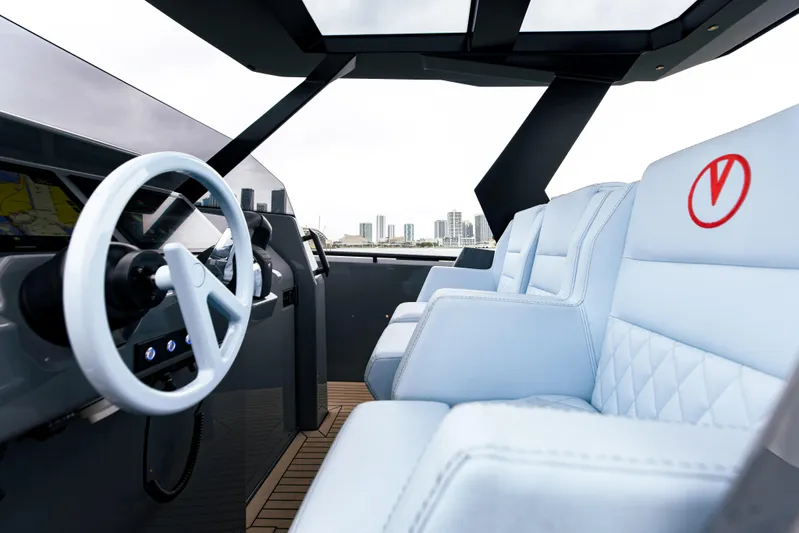  Yacht Photos Pics Interior of 2022 Vanquish Yachts VQ40 with white leather seats and modern steering wheel.