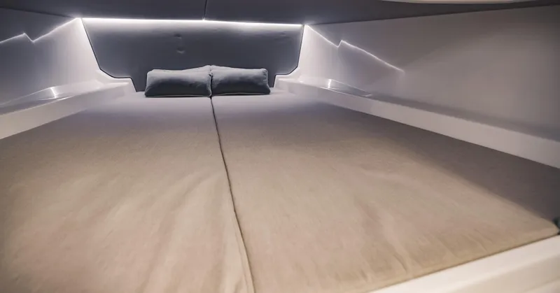  Yacht Photos Pics Interior cabin of 2022 Vanquish Yachts VQ40 with modern bedding.
