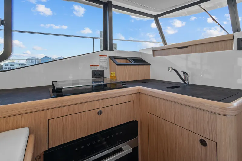 Unfiltered Yacht Photos Pics Modern kitchen area on 2023 Beneteau Swift Trawler 35 yacht.