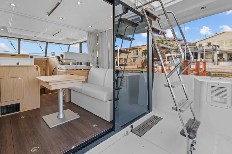 Unfiltered Yacht Photos Pics 2023 Beneteau Swift Trawler 35 interior with modern seating and dining area.