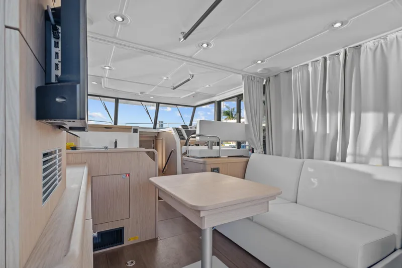 Unfiltered Yacht Photos Pics Interior of 2023 Beneteau Swift Trawler 35, featuring modern seating and helm station.