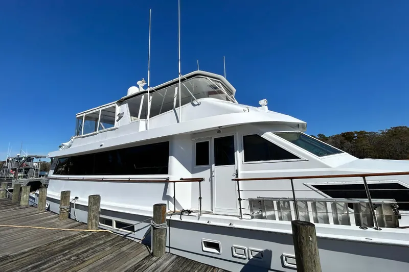 Nother Venture Yacht Photos Pics 1989 Hatteras 78 CPMY yacht docked under clear blue sky.