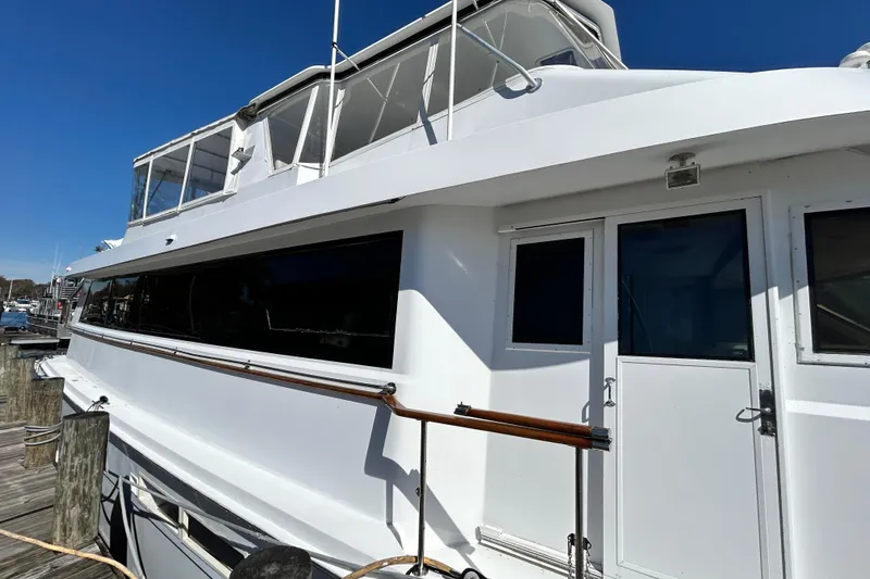 Nother Venture Yacht Photos Pics 1989 Hatteras 78 CPMY yacht docked under clear blue sky.