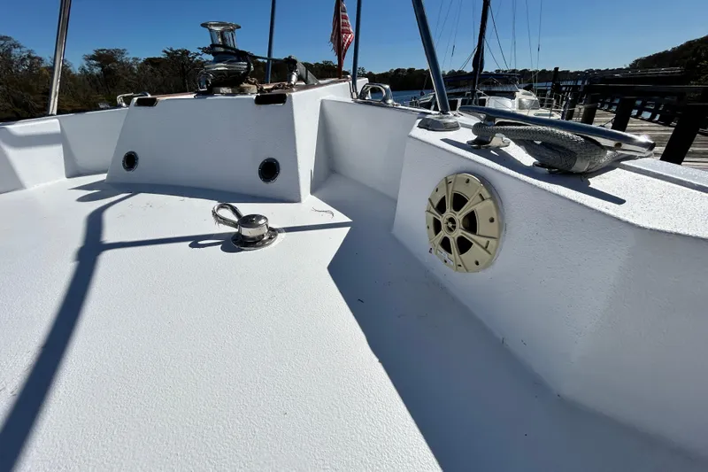 Nother Venture Yacht Photos Pics 1989 Hatteras 78 CPMY yacht deck with cleats and speaker, docked by the water.