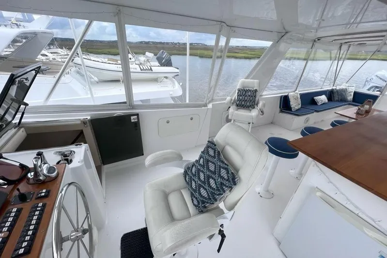 Nother Venture Yacht Photos Pics Luxurious interior of 1989 Hatteras 78 CPMY yacht with plush seating and elegant design.