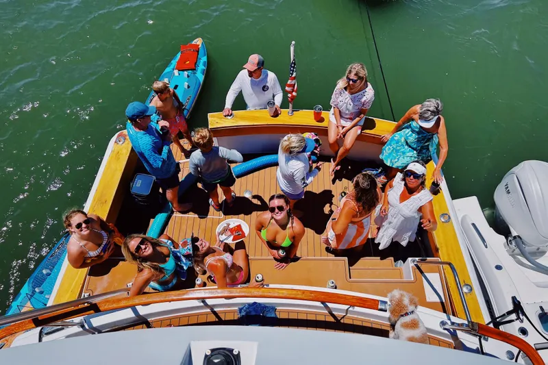 Nother Venture Yacht Photos Pics Group enjoying sunny day on 1989 Hatteras 78 CPMY yacht deck.