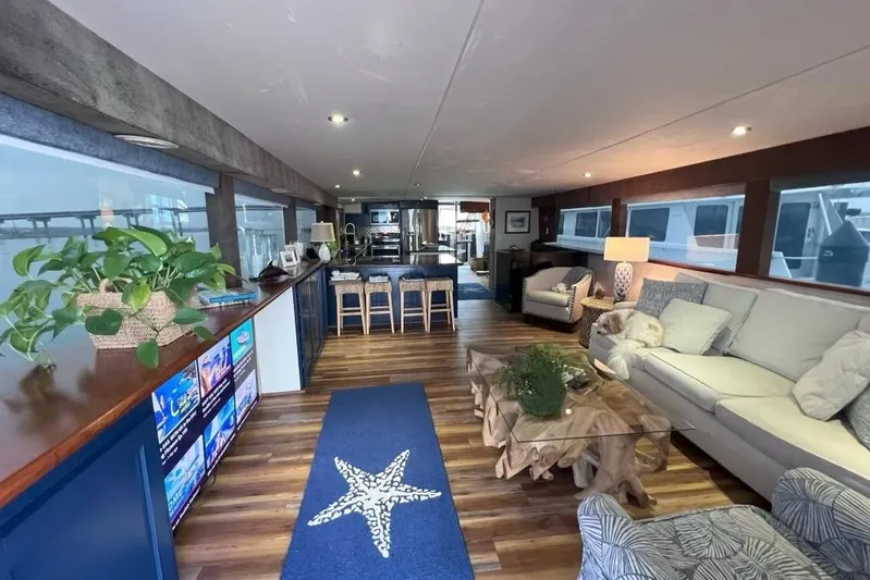 Nother Venture Yacht Photos Pics Luxurious interior of 1989 Hatteras 78 CPMY yacht with modern decor and spacious seating.