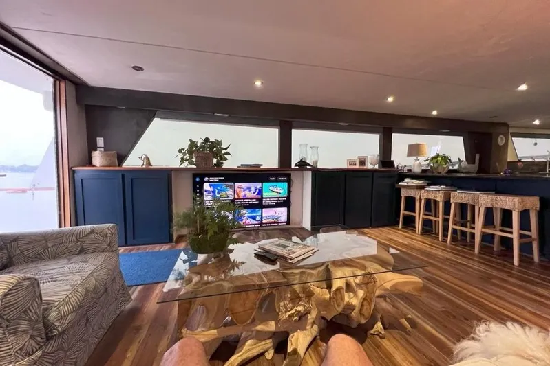 Nother Venture Yacht Photos Pics Luxurious interior of 1989 Hatteras 78 CPMY yacht with modern decor and entertainment center.