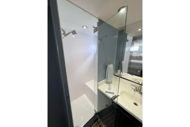 Nother Venture Yacht Photos Pics Bathroom interior of 1989 Hatteras 78 CPMY yacht with shower and sink.