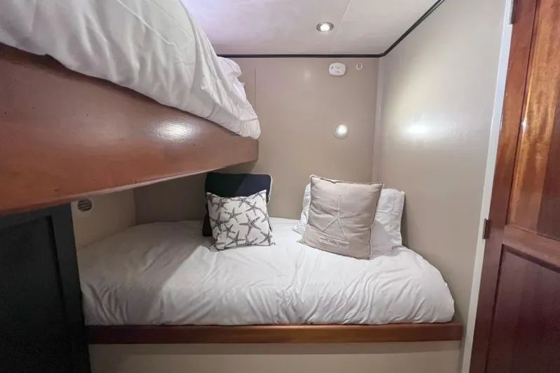 Nother Venture Yacht Photos Pics Cozy cabin with bunk beds on 1989 Hatteras 78 CPMY yacht.