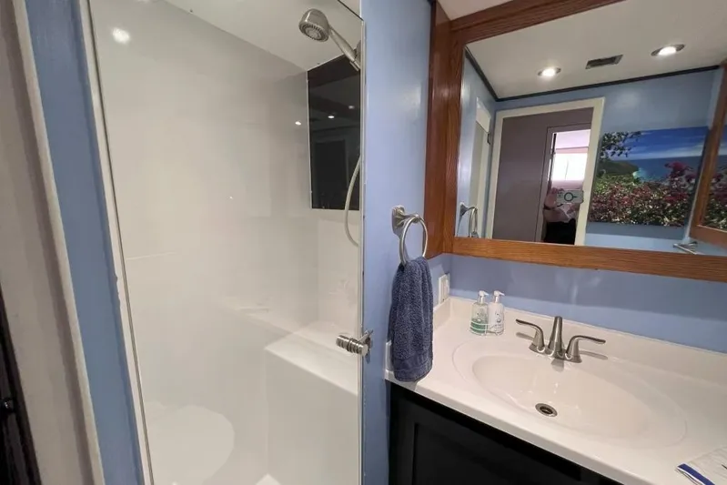 Nother Venture Yacht Photos Pics Bathroom interior of 1989 Hatteras 78 CPMY yacht with shower and sink.