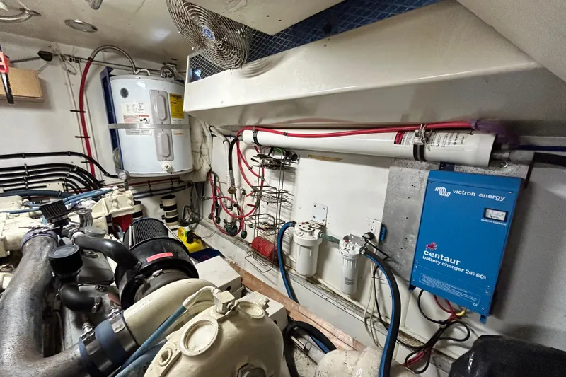 Nother Venture Yacht Photos Pics Engine room of 1989 Hatteras 78 CPMY with equipment and wiring.