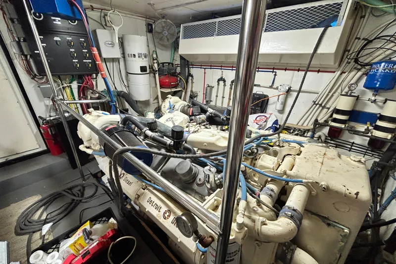 Nother Venture Yacht Photos Pics Engine room of 1989 Hatteras 78 CPMY yacht, featuring Detroit Diesel engine and control systems.