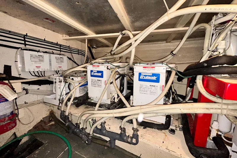 Nother Venture Yacht Photos Pics Engine room of 1989 Hatteras 78 CPMY with Cruisair systems and wiring.