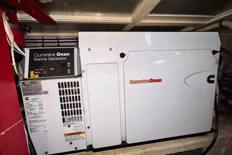 Nother Venture Yacht Photos Pics Cummins Onan marine generator in 1989 Hatteras 78 CPMY yacht engine room.
