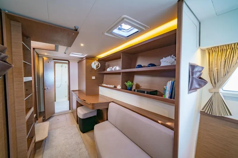 Hopena Yacht Photos Pics Luxurious interior of 2018 Lagoon 42 catamaran with modern furnishings and ample storage.