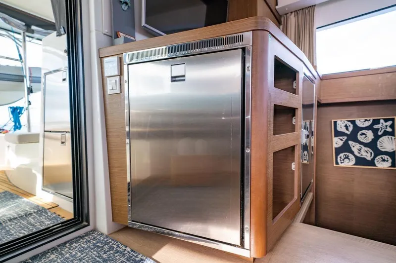 Hopena Yacht Photos Pics Interior of 2018 Lagoon 42 yacht featuring a modern stainless steel refrigerator.