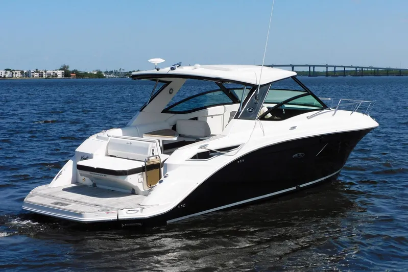 Not Guilty Yacht Photos Pics 2018 Sea Ray Sundancer 320 boat on open water, showcasing sleek design and luxury features.