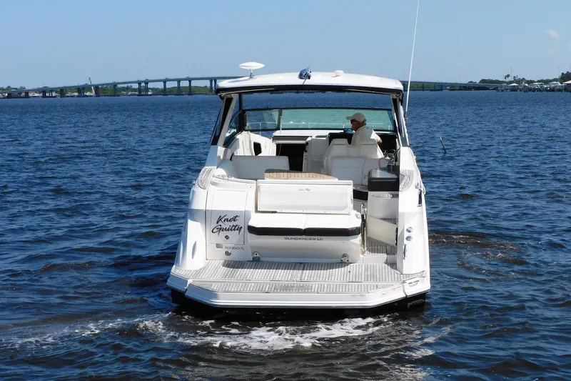 Not Guilty Yacht Photos Pics 2018 Sea Ray Sundancer 320 boat cruising on open water.