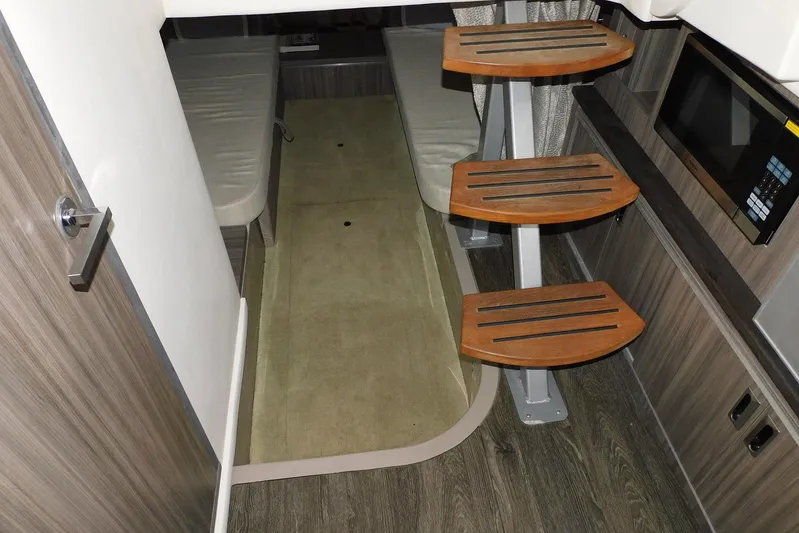 Not Guilty Yacht Photos Pics Interior of 2018 Sea Ray Sundancer 320, featuring wooden steps and modern amenities.