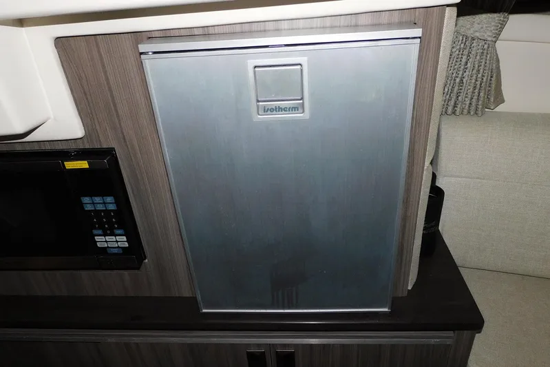 Not Guilty Yacht Photos Pics 2018 Sea Ray Sundancer 320 interior with Isotherm fridge and microwave.