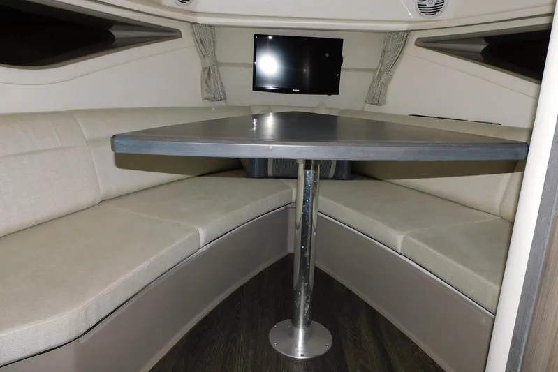 Not Guilty Yacht Photos Pics Interior of 2018 Sea Ray Sundancer 320 with cozy seating and table.