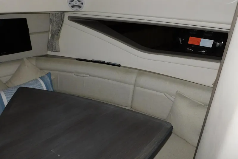 Not Guilty Yacht Photos Pics Interior of 2018 Sea Ray Sundancer 320, featuring cozy seating and modern design.