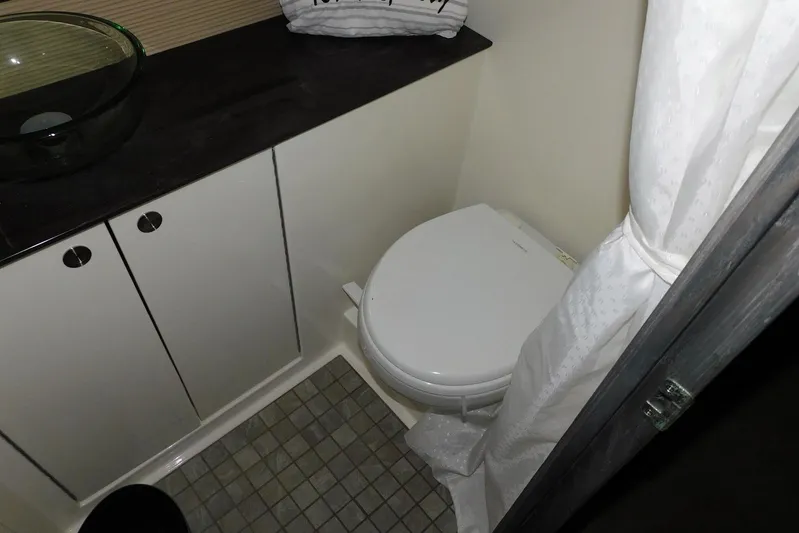 Not Guilty Yacht Photos Pics 2018 Sea Ray Sundancer 320 bathroom with modern fixtures and compact design.