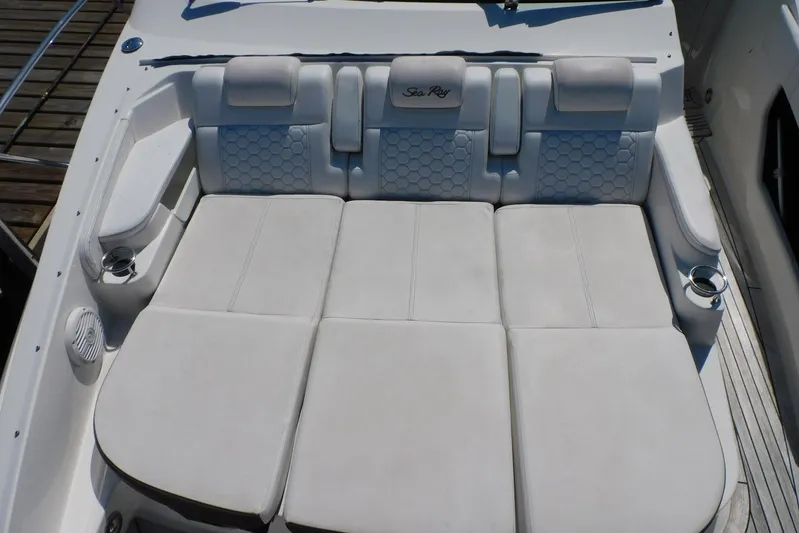 Not Guilty Yacht Photos Pics Luxurious seating on 2018 Sea Ray Sundancer 320 boat, featuring white cushioned upholstery.