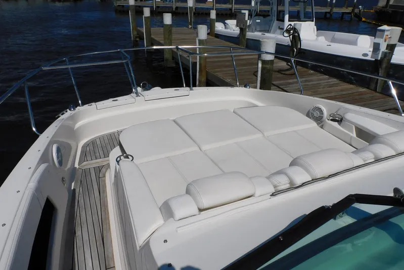 Not Guilty Yacht Photos Pics 2018 Sea Ray Sundancer 320 boat with spacious sunbathing deck at marina.
