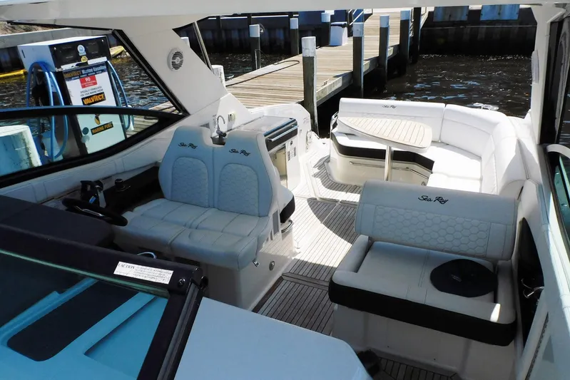 Not Guilty Yacht Photos Pics 2018 Sea Ray Sundancer 320 interior with plush seating and elegant design.