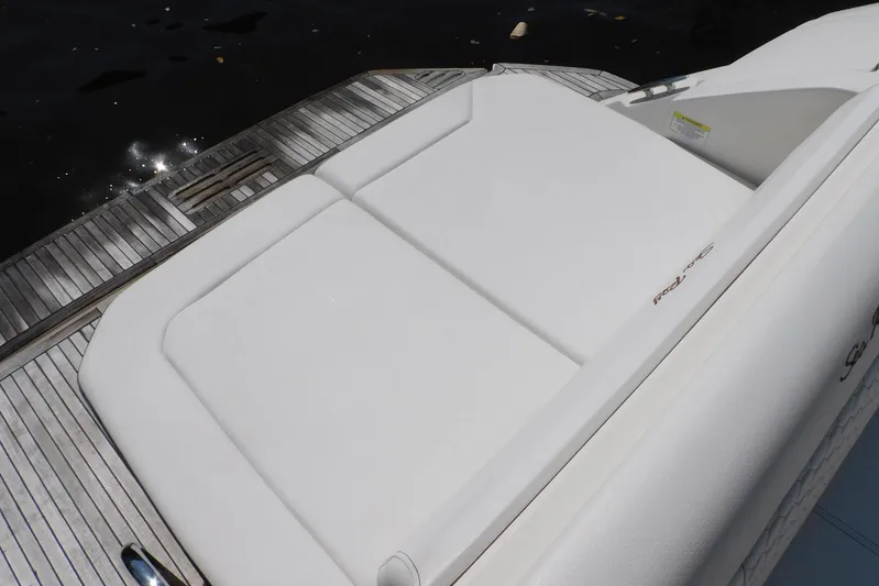 Not Guilty Yacht Photos Pics 2018 Sea Ray Sundancer 320 swim platform with cushioned seating, docked by the water.