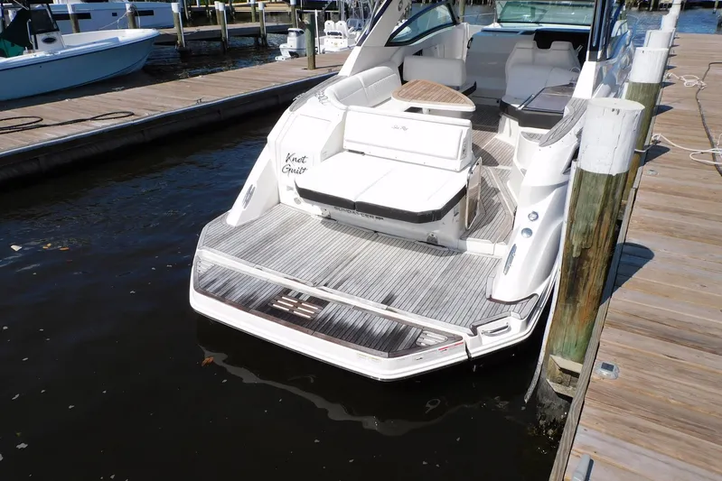 Not Guilty Yacht Photos Pics 2018 Sea Ray Sundancer 320 docked, featuring spacious deck and seating area.