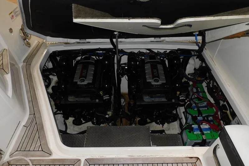 Not Guilty Yacht Photos Pics Engine compartment of 2018 Sea Ray Sundancer 320 with dual engines and batteries.