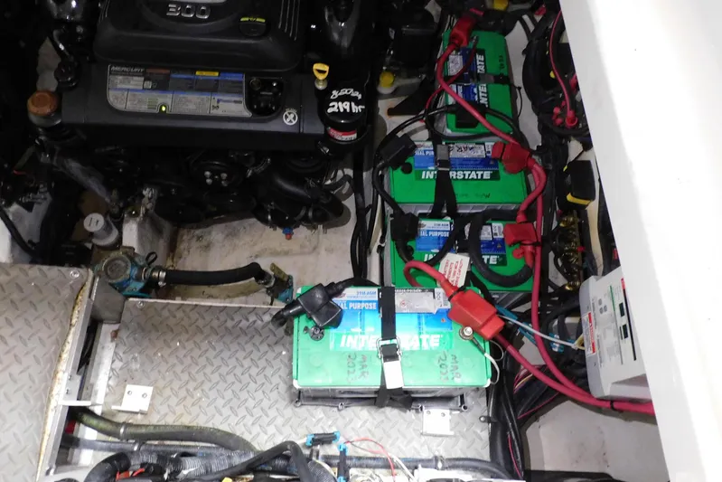 Not Guilty Yacht Photos Pics Engine compartment of 2018 Sea Ray Sundancer 320 with batteries and wiring.
