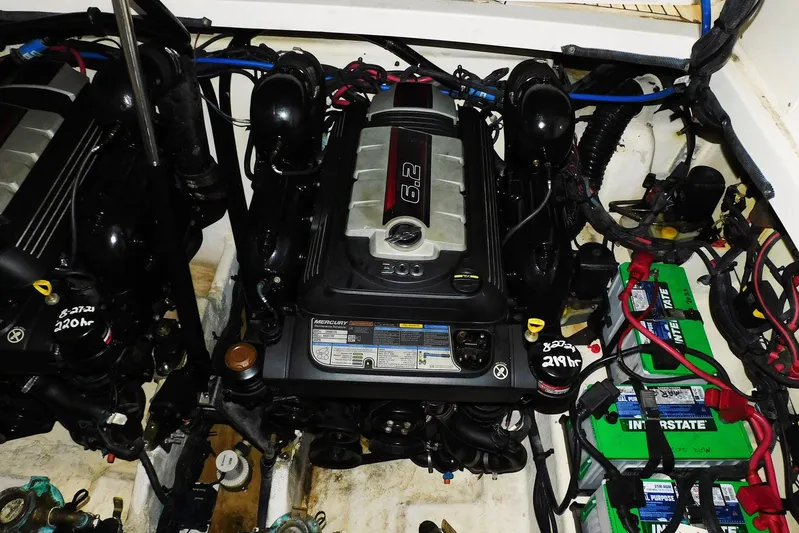 Not Guilty Yacht Photos Pics Engine compartment of 2018 Sea Ray Sundancer 320 with dual Mercury 6.2 engines and batteries.