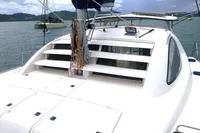 2009 Leopard 40 catamaran on water, featuring deck and rigging, with scenic background.