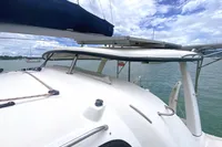 2009 Leopard 40 catamaran deck with blue sky and water backdrop.