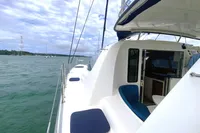 2009 Leopard 40 catamaran on water, featuring spacious deck and cabin entrance.