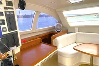 Interior of 2009 Leopard 40 catamaran with seating, table, and control panel.