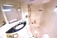 Bathroom interior of a 2009 Leopard 40 yacht, featuring a shower and sink.