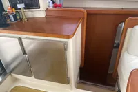 Interior of 2009 Leopard 40 yacht with wooden cabinetry and stainless steel doors.
