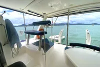 Interior view of 2009 Leopard 40 catamaran with ocean and island backdrop.