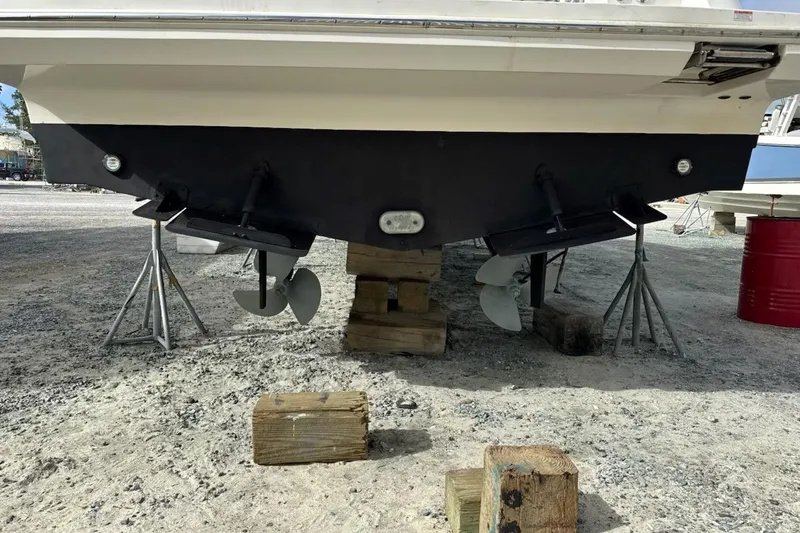 Mjm Grand Yacht Photos Pics 2020 Carver 36 Command Bridge boat on stands, showing propellers and hull.