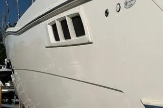 Mjm Grand Yacht Photos Pics 2020 Carver 36 Command Bridge yacht, sleek white exterior, docked under clear blue sky.