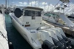  Yacht Photos Pics 2022 Boston Whaler 405 Conquest docked at marina with triple outboard engines.